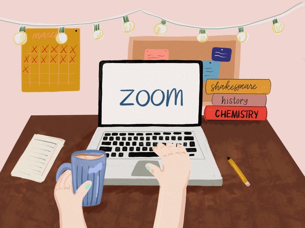 Cartoon of a laptop with "Zoom" across it.  Books are in the background, with a coffee, pencil and paper on the desk.